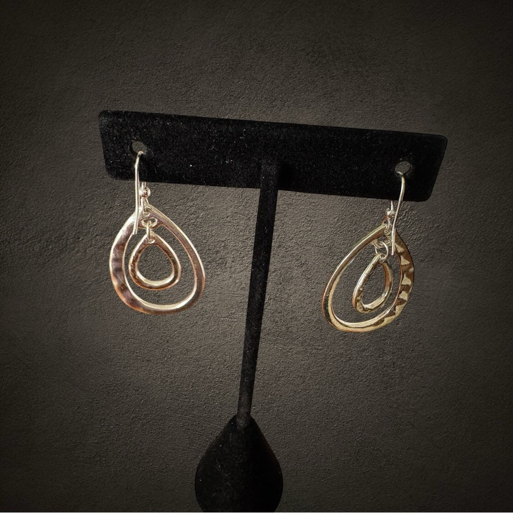 Pair of hammered metal double teardrop dangle earrings. Silver colored. NWOT.